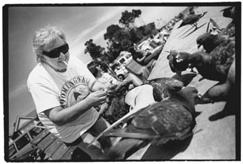 Betty feeding the pigeons at Capitola Beach, California