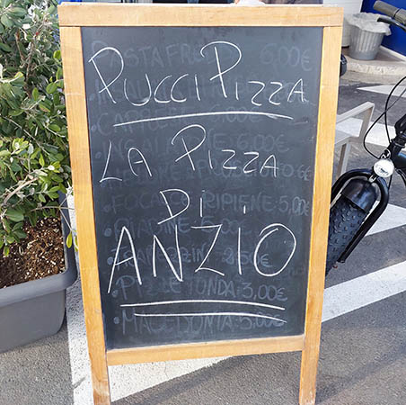 Menu board at Pucci Pizza, Anzio, Italy