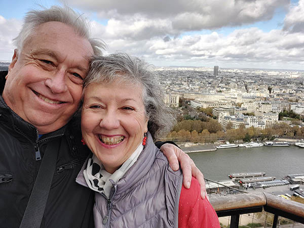 Older smiling couple at the Tour Eiffel, Paris, France