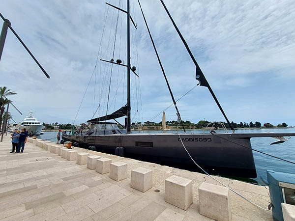 Sleek sailing vessel at Brindisi Harbor, Italy