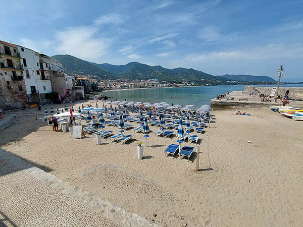 Umbrellas all lined up at the beach, Cefau, Sicily