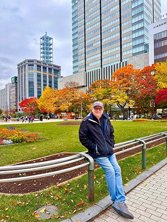 Older gentleman Enjoying the autumn colors in Sapporo, Japan