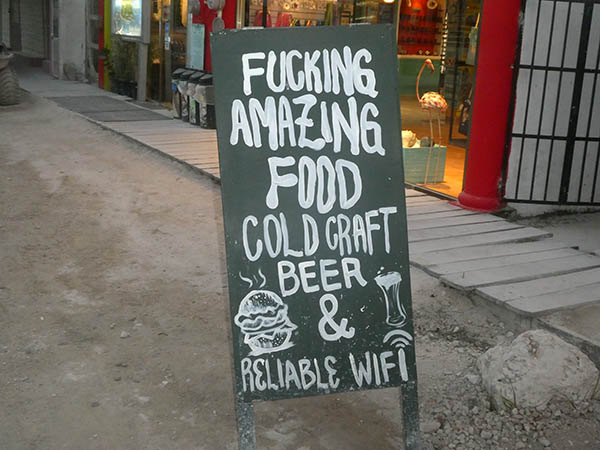 Sign advertising food and beer, Isla Holbox, Quintana Roo, Mexico