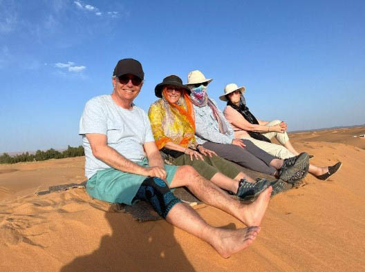 sitting on a sand dune in Morocco