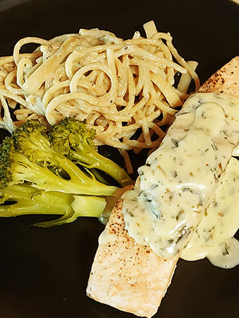 Grilled fresh salmon with Béarnaise sauce, Roquefort noodles and fresh broccoli