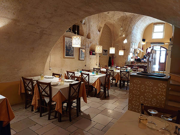 Inside shot of the cave restaurant Soul Kitchen, Matera, Italy