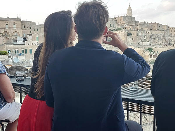 Romantic couple overlooking The Sassi at Terrazza Calaviere, Matera, Italy