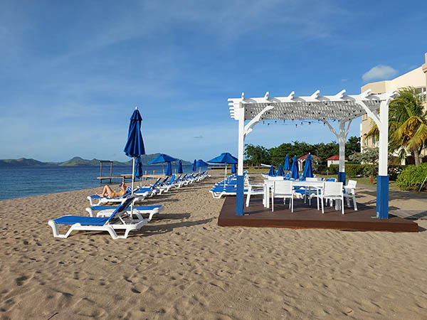 lounge chairs and cabana on the beach at Hamilton Beach Villas and Spa, Nevis, West Indies