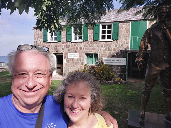 Senior couple out in front of Alexander Hamilton Museum, Nevis, West Indies
