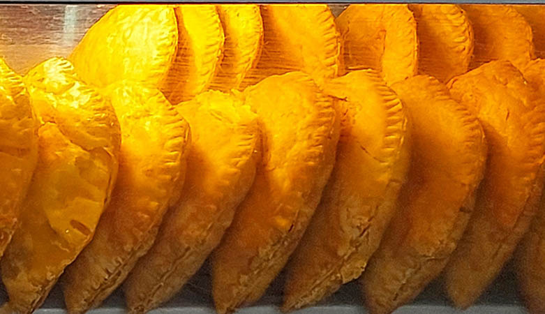 Fried Johnny Cakes all in a row at bakery, Nevis, West Indies 