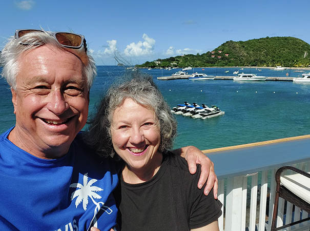 Senior Couple near Oualie Beach, water taxi pier from On The Rocks Bar and Lounge 