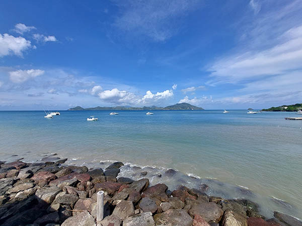 St. Kitts island in the background, blue skies, blue water from On The Rocks Bar and Lounge, Nevis, West Indies