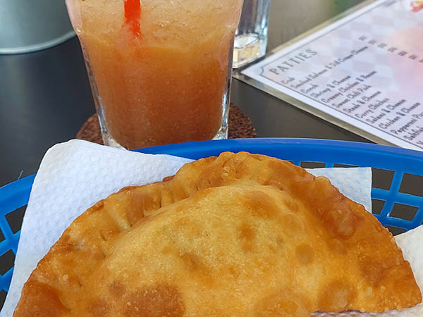 Rum punch and patty at Rosie's Pattys, Nevis, West Indies