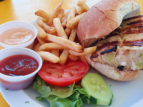 Mahi mahi fishburger and salad at Sunshine's Beach Bar and Restaurant, Nevis, West Indies