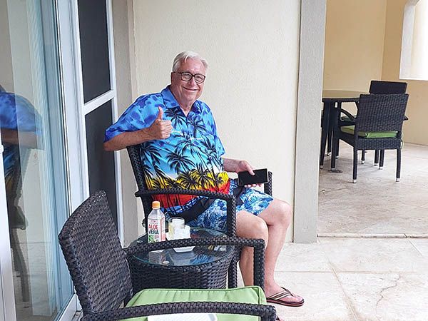 Senior man on outdoor veranda Hamilton Villas on Nevis, West Indies