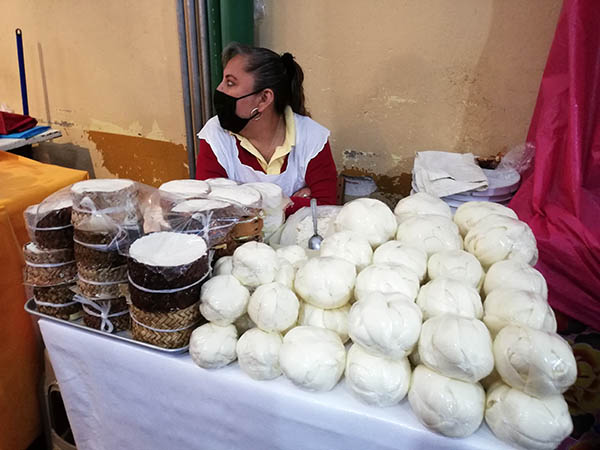 Oaxaca cheese and fresh day cheese in baskets, Oaxaca Central Market, Oaxaca, Mexico