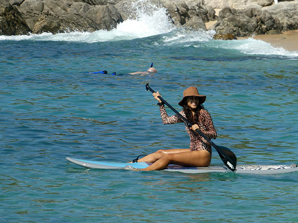 Girl on her surfboard, Playa Manzanillo, Puerto Escondido, Mexico