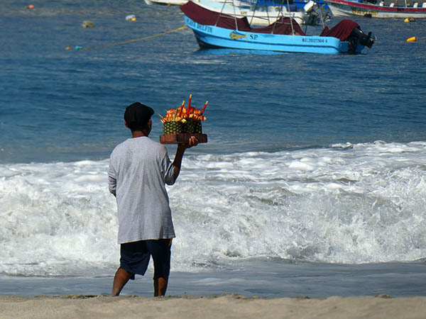 Vendor selling fruit on Playa Principal, Puerto Escondido, Mexico