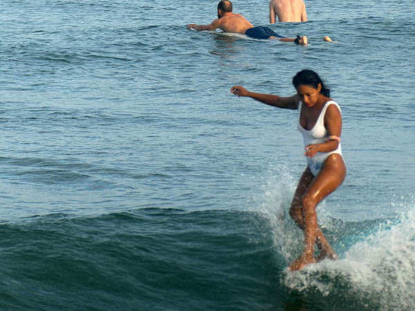 Newbie surfer keeping her balance, Sayulita, Nayarit, Mexico