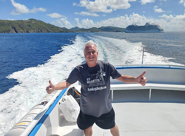 Senior man giving thumbs up on ferry, St. Barth