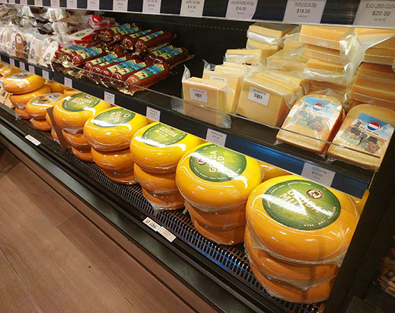 Blocks, rounds, chuncks of wrapped Gouda cheeses, Amsterdam Cheese and Liquor Store, Philipsburg, Sint Maarten