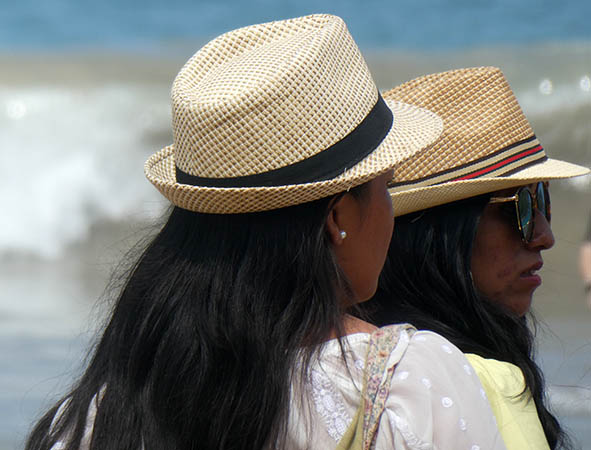 Young ladies wearing their fedoras, Chacala beach, Mexico