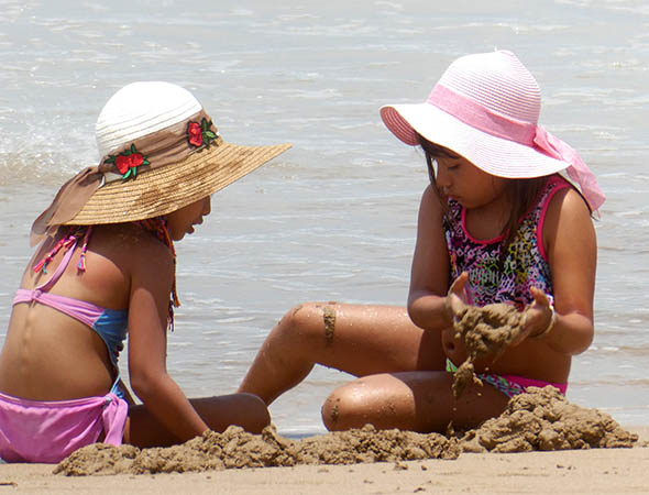Sweet baby girls in their bonnets, Chacala beach, Mexico