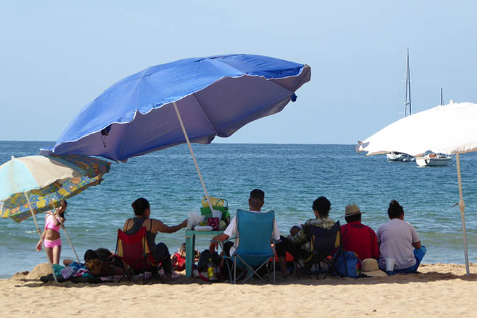 Beach tables and umbrellas for rent