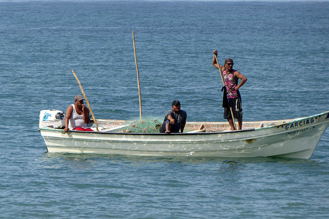 Local fishermen with their boat and net