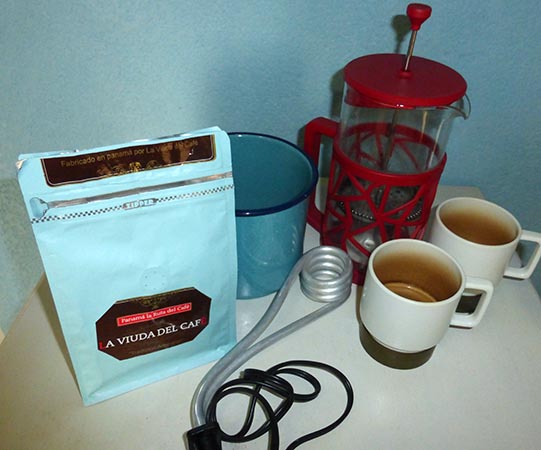 Bag of freshly ground coffee, ceramic pot, heater coil, French press coffee pot, lightweight unbreakable coffee cups
