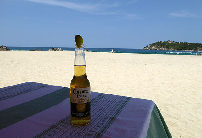 Beer on the beach, Playa Principal, Puerto Escondido, Mexico