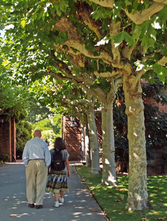 Tom Rogers and Akaisha walk down the shaded sidewalks of Filoli Gardens, Woodside, California
