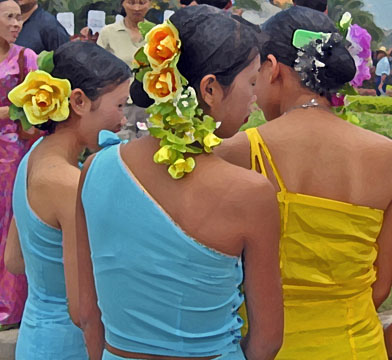 Chinese women with flowers in their hair, Jinghong, China