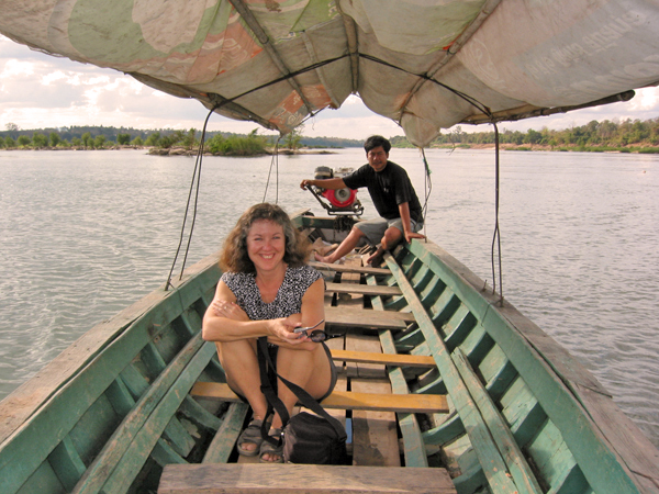 Akaisha in a longboat on the Mekong River